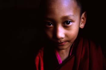<b>Bhutan, Paro</b>, A child monk in the dark